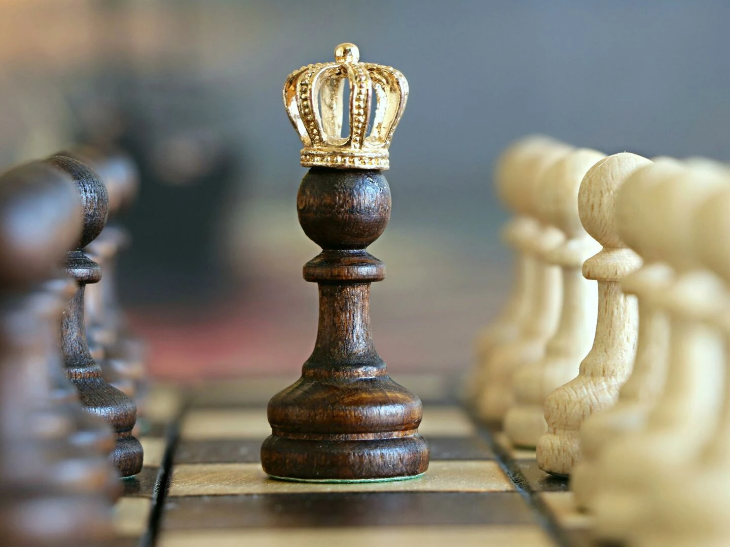 a brown pawn with a crown stands prominently on a chessboard symbolizing strategic play