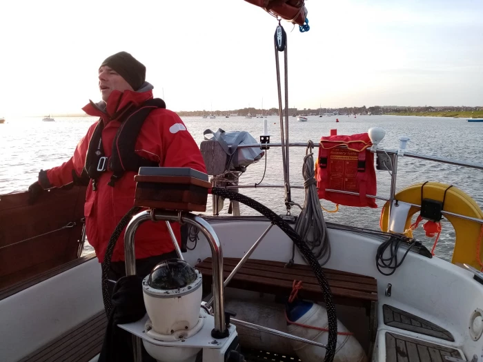 andy at the helm ain full foul weather gear as we leave plymouth