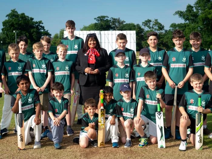 as part of its tattenhall community fund redrow has donated pound1280 for shirts caps and helmets with redrow branding for the u9 u11 u13 u15 and u18 teamspictured are redrow sales consultant anita gillespie with the squad credit  leeboswel
