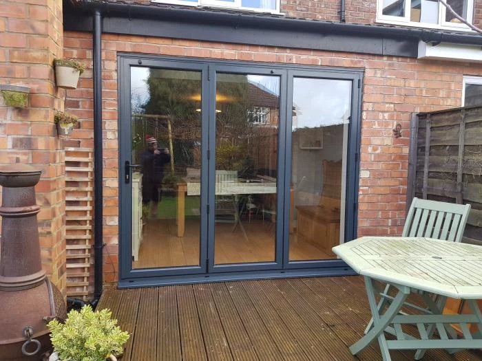 black patio door with wood decking