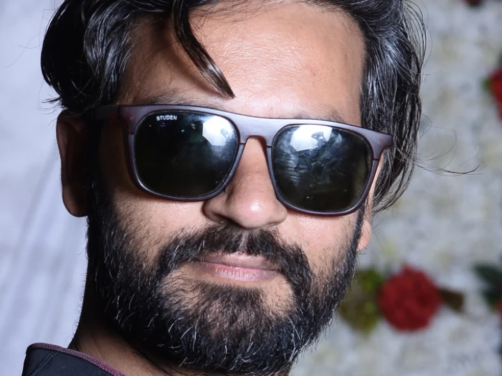 Man wearing Ray-Ban sunglasses