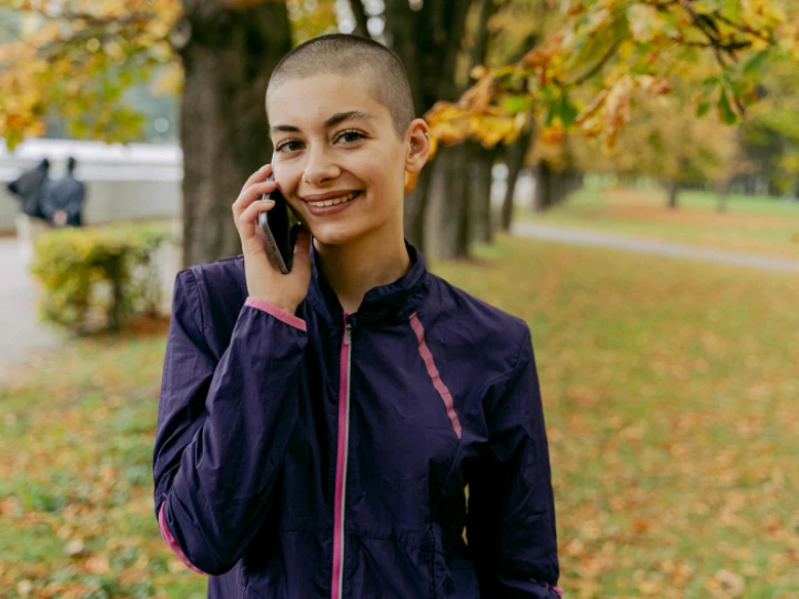 Woman in Purple Jacket receives a Phone Call 