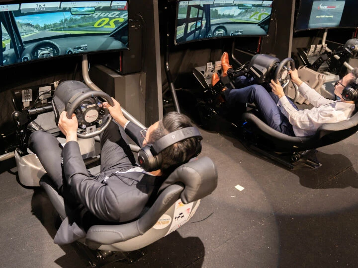 Two drivers in simulator rigs