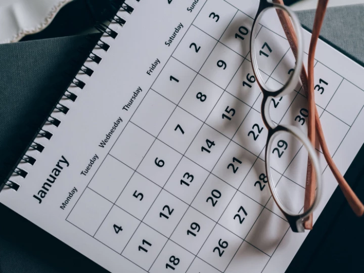 Brown-Framed Eyeglasses on a Calendar