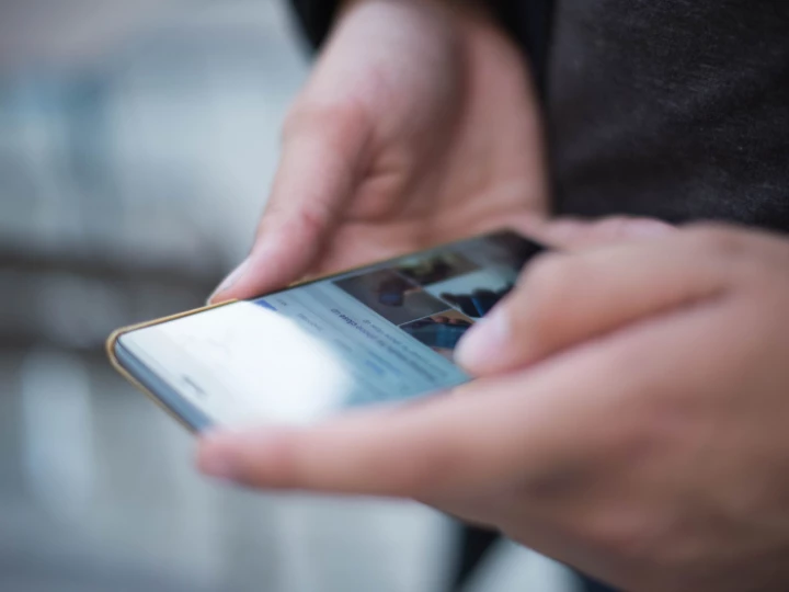 Person Using Smartphone Shallow Focus Photography