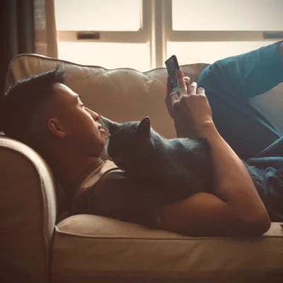 male relaxing with cat