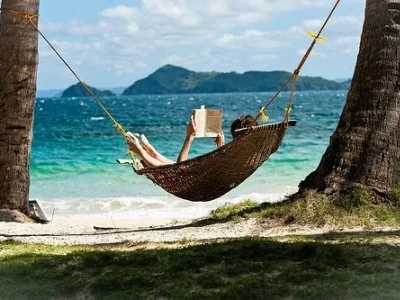 reading in a hammock on the beach