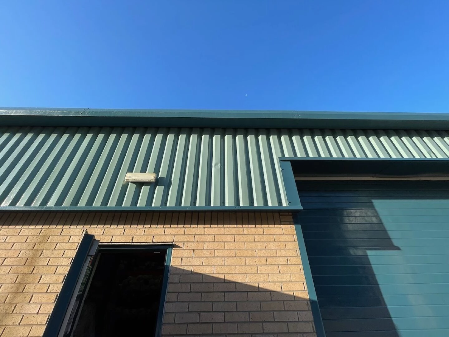 closeup of greenroofed warehouse building