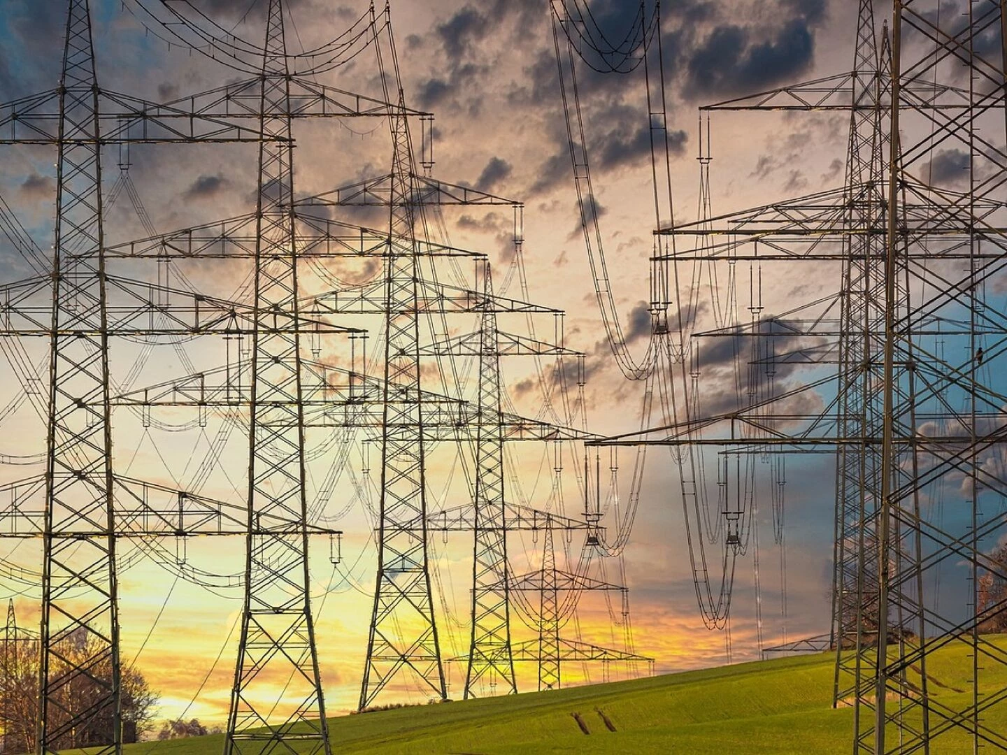electricity electricity pylons power lines high voltage pylons high voltage high voltage line electric cable nature industry energy technology electrics sunset multicoloured clouds power line orange yellow blue