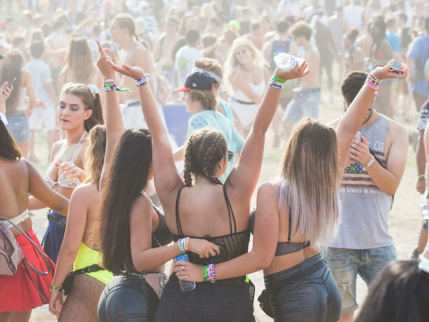 energetic crowd enjoying an outdoor festival with music and dancing perfect for lifestyle and event themes