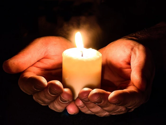 hands open candle