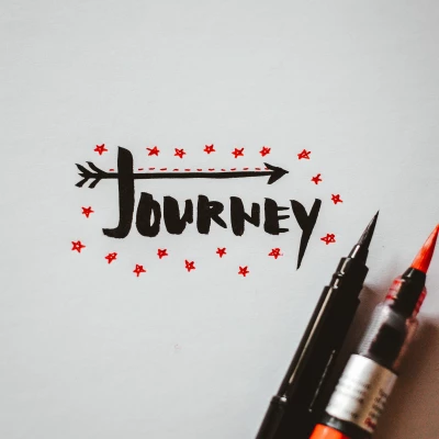 handwritten sign with text 39journey39 red pen white pen