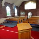 higham the new look  into the church from the front