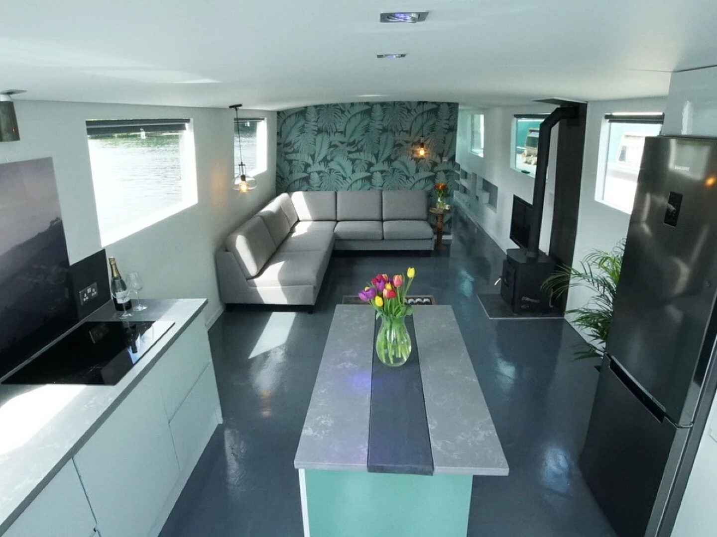 interior of a solarpowered boat showing kitchen and dining area