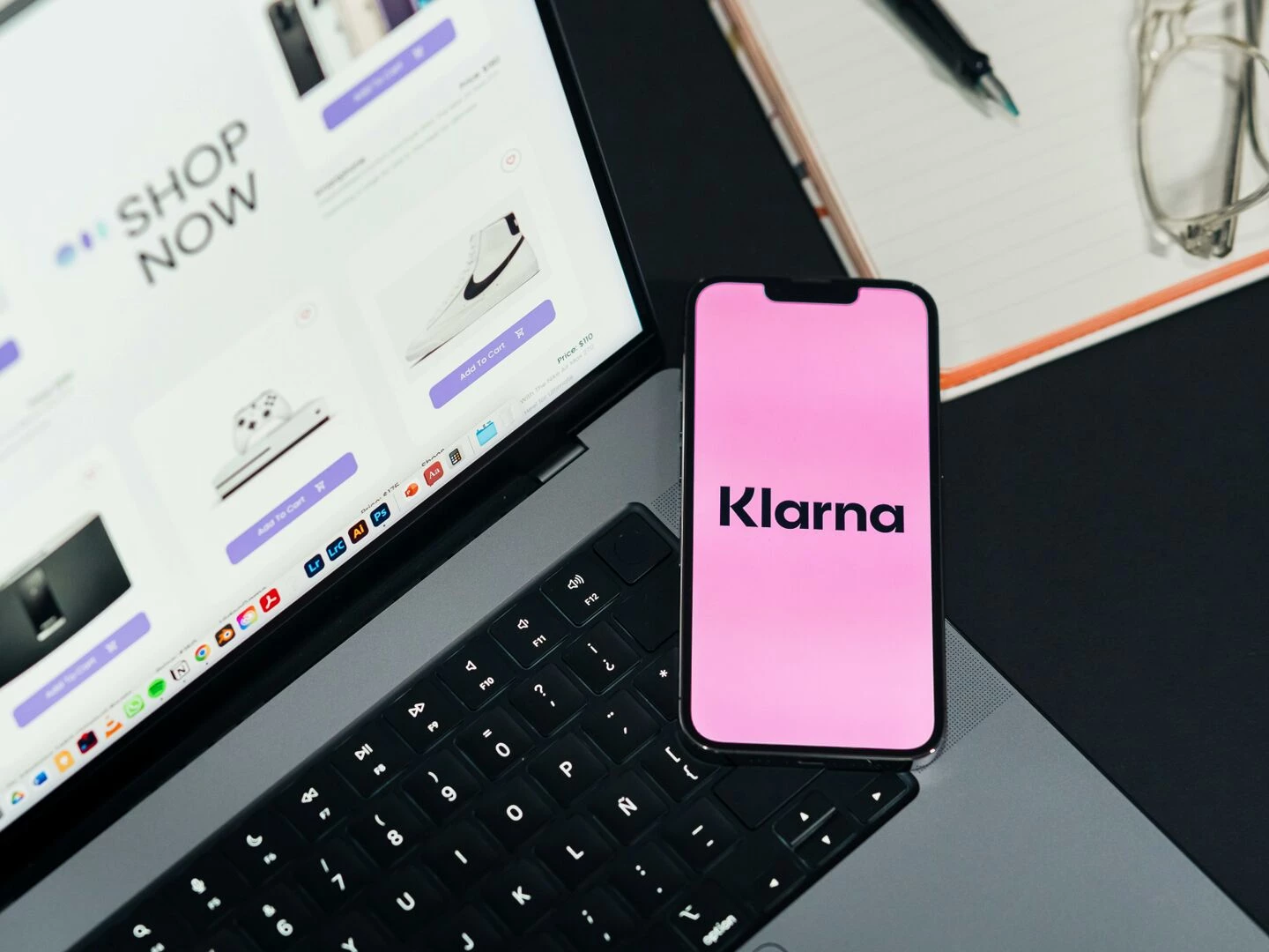 laptop and smartphone displaying online shopping and klarna for convenient ecommerce