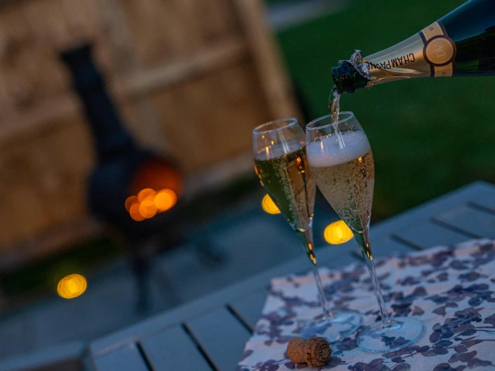 overwater luxury glamping champagne by the chiminea 7