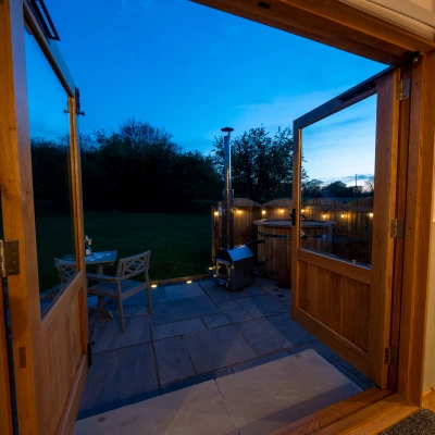 overwater luxury glamping hodnet interior looking out to the hot tub 2