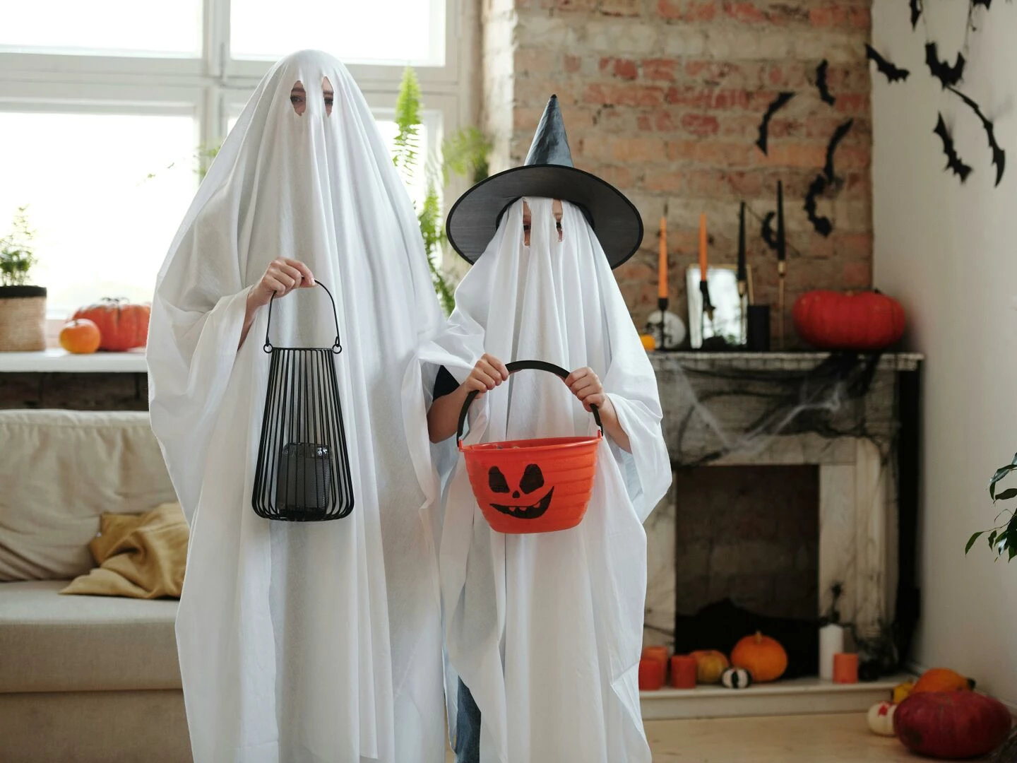 people in ghost costumes
