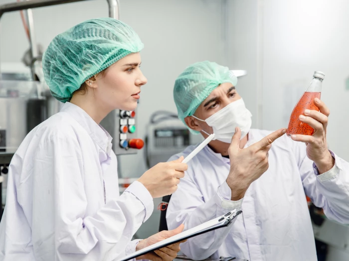 quality control and food safety team inspection the product standard in the food and drink factory production line