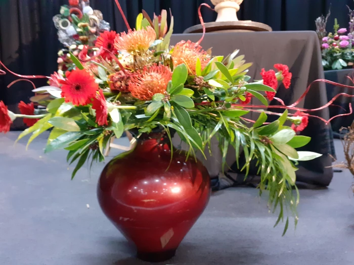 red vase christmas arrangement