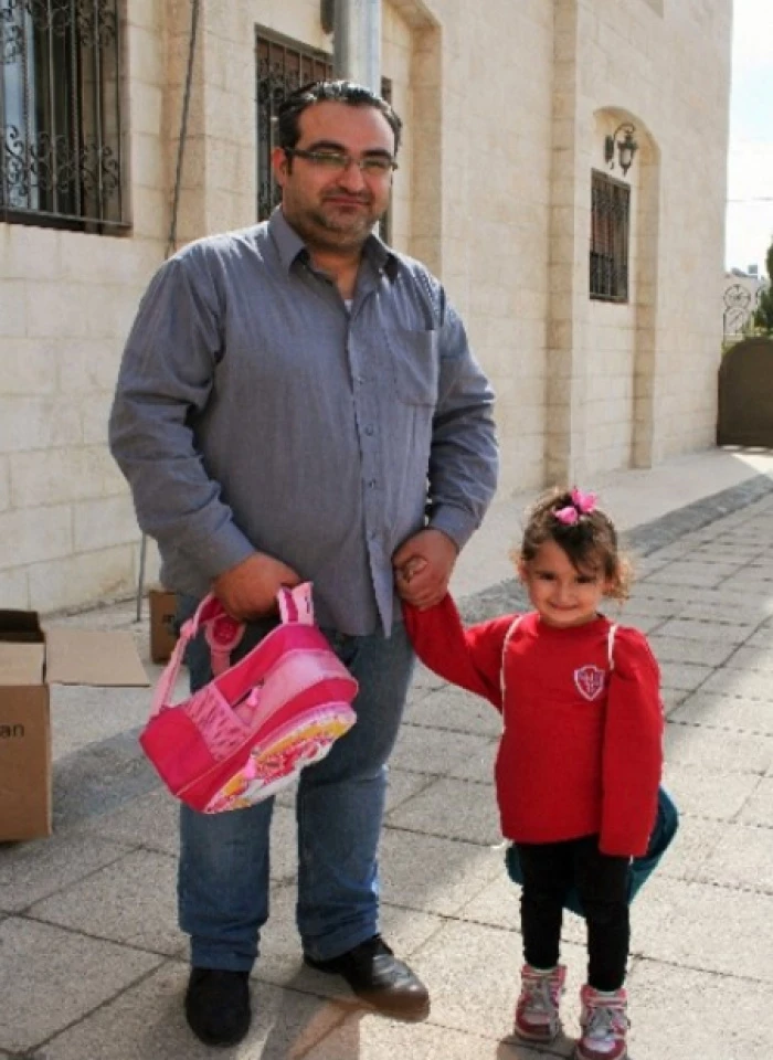tajik and daughter  syrian refugees in jordan