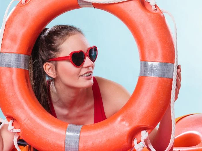 woman in sunglasses with ring buoy lifebuoy