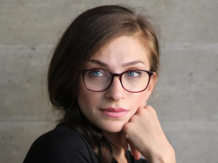 woman wearing red spectacles