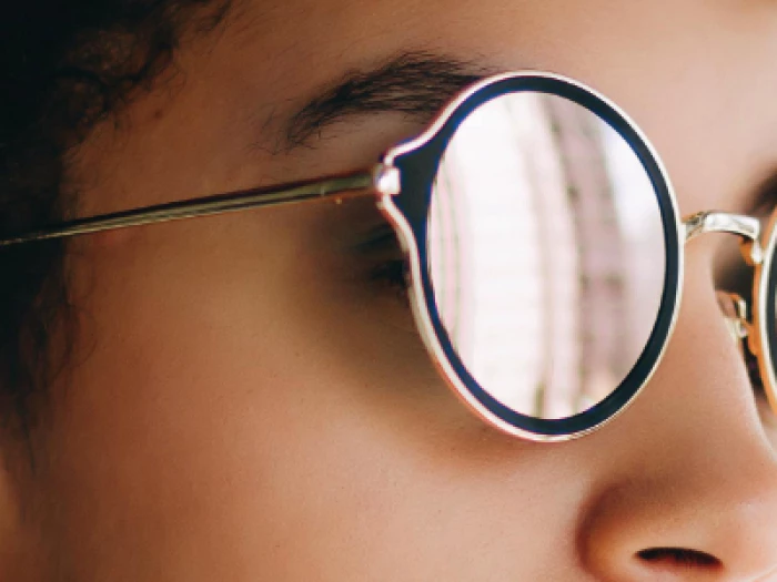 woman with black and white retro sunglasses