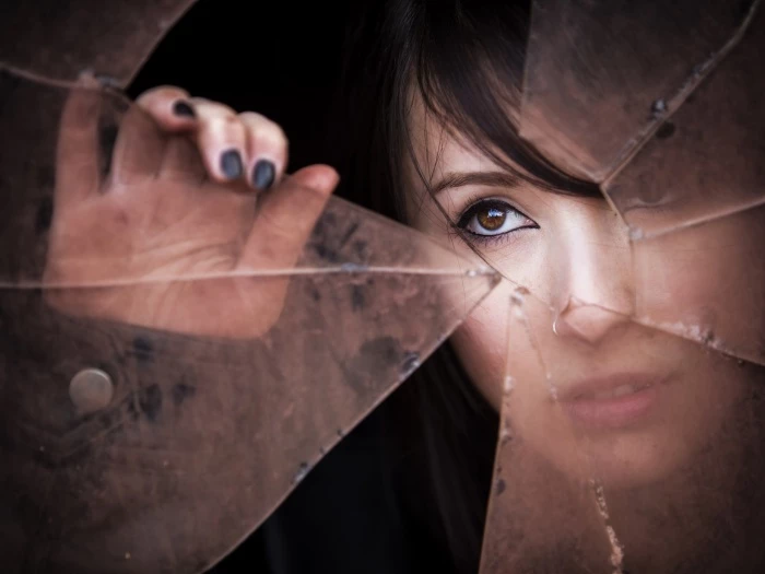 woman39s face at broken window