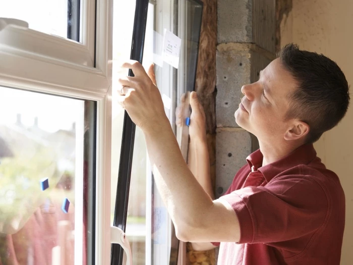 worker installing replacement window